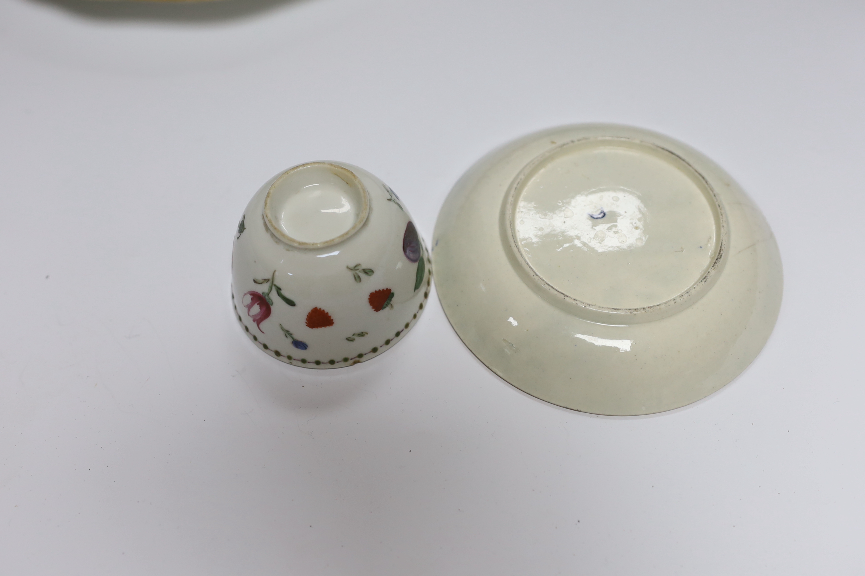 A pair of Samson Worcester style scale blue dishes, a Worcester fruit painted tea bowl and saucer, c.1780 and another teabowl together with a pair of Derby armorial plates, c.1820 and two jugs